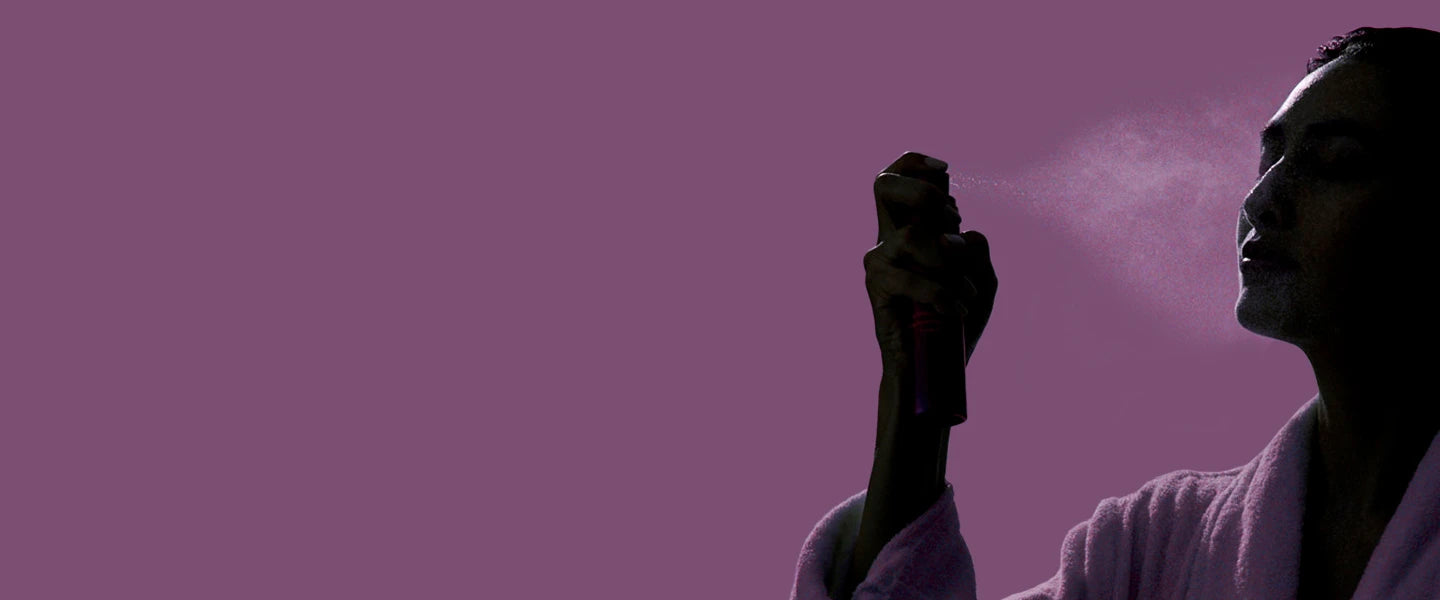 A person spraying a spray