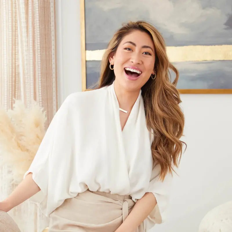A person laughing in a room