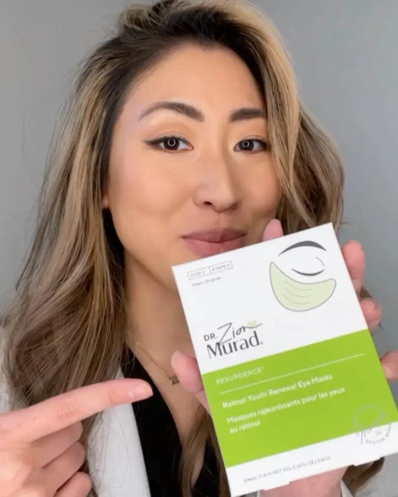 Dr. Zion Ko holding a pack of Retinol Youth Renewal Eye Mask