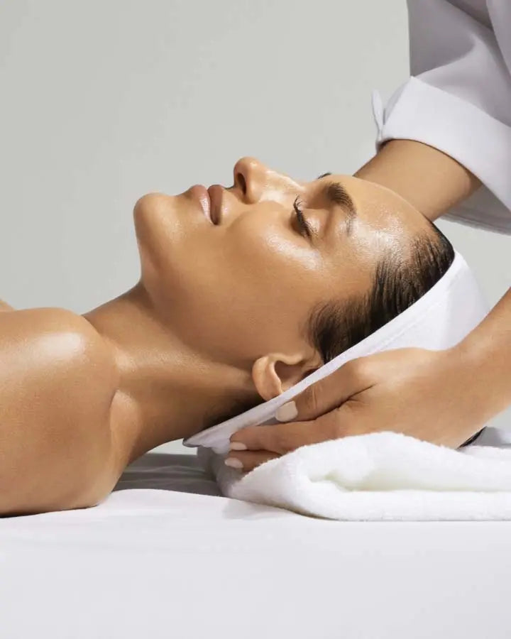 a person lying down with her eyes closed