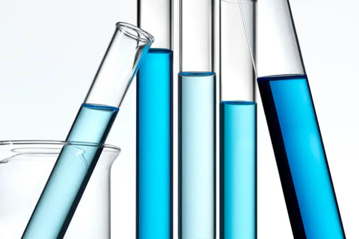A group of test tubes with blue liquid
