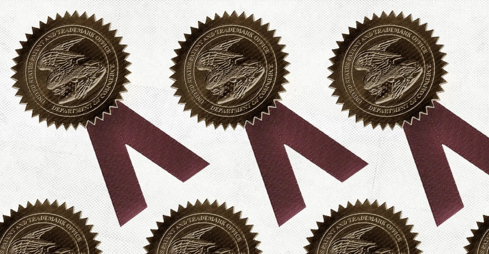 A group of gold seals with ribbons