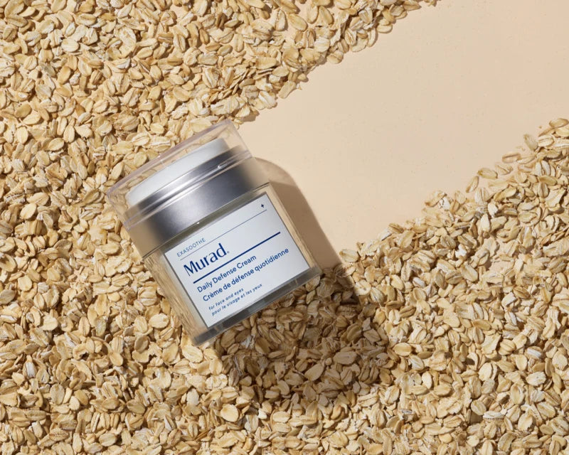 A container of Sooth Oat and Peptide Cleanser on top of a pile of oats