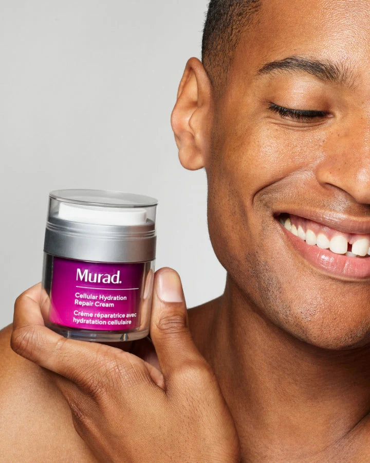 A person holidng a jar of Cellular Hydration Repair Cream