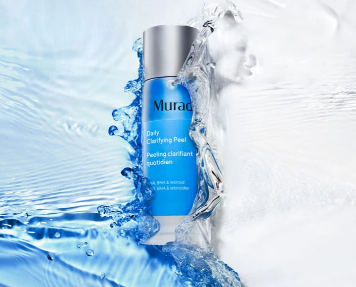 a Bottle of Daily Clarifying Peel surrounded by blue & clear water